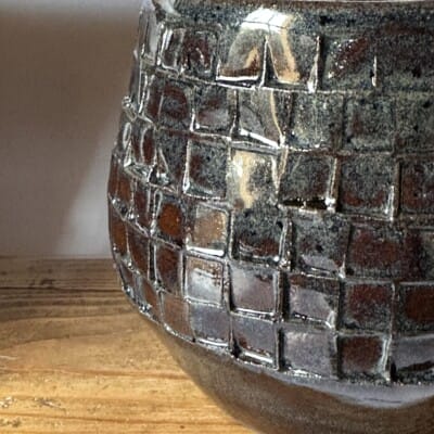Close-up of Black patterned pot - Atlantis